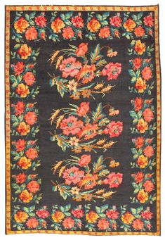 an old rug with flowers on it