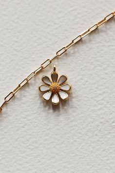 14k Gold filled enamel white daisy flower charm is sweet and happy. Add some joy to your charm necklace with this cute bloom. Hand make your custom charm necklace in Laguna Beach or build your piece online through adding a base necklace and your selection of charms. Leave us a note on your order for any special requests. 14K gold filled Tarnish resistant Enamel White Daisy Flower, Custom Charm Necklaces, Daisy Charm, Custom Charms, Ceramic Gifts, White Daisy, Candle Collection, Laguna Beach, Swim Accessories