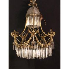 an antique chandelier hanging from the ceiling