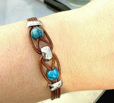 I am offering a Handmade Unisex Leather Band Bracelet with 8mm Blue Crazy Lace Agate Gemstones. It is constructed with 1.5mm genuine leather cord, 6mm hammered silver plated barrel beads, crimp end caps and magnetic clasps. Each bracelet is custom made; please choose your wrist size from the drop down box when ordering. I will combine shipping for multiple orders. Diy Gemstone Bracelet, Diy Leather Bracelet Tutorial, Hemp Bracelet Patterns, Leather Bracelet Tutorial, Diy Leather Bracelet, Leather Jewelry Diy, Leather Cord Bracelets, Handmade Leather Bracelets, Bracelets Handmade Diy