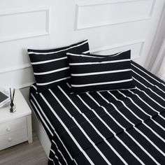 black and white striped bedding in a bedroom