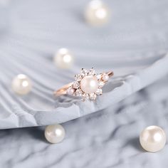 an image of a ring with pearls on it