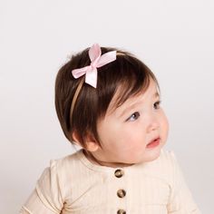 Dress your little one up with our satin bows! Handmade by local moms from high-quality satin. This is the perfect bow for your darling little girl! Each bow is hand tied and is attached to a nylon headband. All bows are secured so they do not come undone! Size:Small - 2.5 in x 1.5 inLarge - 3.5 in x 2 in Spring Satin Bow Headband, Cute Adjustable Hair Accessories With Satin Bow, Adjustable Bow With Matching Headband For Spring, Spring Hair Accessories With Matching Headband For Playtime, Adjustable Pink Bow Headband, Adjustable Pink Headband With Bow, Pink Satin Bow Headband Gift, Adjustable Cute Headband, Adjustable Cute Band Headband