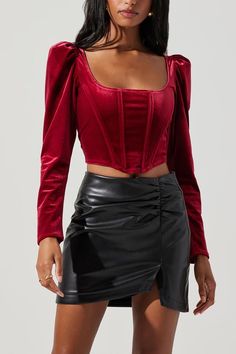 A stunning garment blends the sumptuous allure of velvet with the contemporary charm of the crop top, creating a piece that embodies sophistication and trendiness.Square neckline and corset detail on bodice Corset With Sleeves, Corset Long Sleeve Top, Velvet Corset Top, Red Corset Top, Corset Outfits, Velvet Corset, Sheer Tops, Red Corset, Boned Corsets