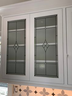 two stained glass cabinets in a kitchen