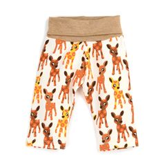 a small child's pants with an image of a giraffe on it