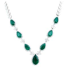 Check out this one-of-a-kind emerald necklace! The necklace features 7 natural Colombian emeralds weighing 10.25 ct and round brilliant cut diamonds weighing 17.3 ct set in 18k white gold. A gorgeous showstopper!! Emerald Diamond Necklace For Formal Occasions, Dazzling Formal Emerald Gemstone Necklace, Pear-shaped Emerald Necklace For Formal Events, Luxury Pear-shaped Emerald Gemstone Necklace, Exquisite Green Diamond Necklace For Formal Occasions, Pear-shaped Emerald Gemstone Necklace For Formal Occasions, Pear-shaped Emerald Gemstone Necklace For Formal Events, Formal Emerald Diamond Necklace In White Gold, Luxury White Gold Emerald Diamond Necklace