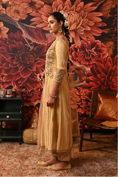 Bring luxury and simplicity to your wardrobe with this gold kurta set this season. The gold ensemble exudes poise adorned with embroidery, highlighted with beads and a golden hue giving you that feel of royalty. A translucent sheer dupatta is added with cutwork and minimal embroidery at the borders. Pair up with minimal earrings and statement bangles and you are good to go. Gold foil printed Kurta with embroidered yoke and cuffs Hem of the Kurta and Sleeves finished with gota patti lace Dupatta Luxury Gold Chanderi Dress, Luxury Gold Floor-length Kurta, Statement Bangles, Minimal Embroidery, Sheer Dupatta, Butterfly Net, Open Image, Straight Fit Pants, Minimal Earrings