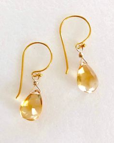 "Lovely golden color citrine pear briolette earrings in 24k gold vermeil or sterling silver.  Faceted citrine gemstones are 12 x 8mm and wire wrapped in gold vermeil on darling little handmade gold vermeil hooks. Total drop is 1 1/4\". Also available in .925 sterling silver." Gold Briolette Teardrop Handmade Earrings, Gold Teardrop Gemstone Earrings, Handmade Gold Briolette Teardrop Earrings, Yellow Gold Gemstone Teardrop Earrings, Gold Pear-shaped Citrine Jewelry, Pear-shaped Citrine Gold Jewelry, Gold Teardrop Earrings With Gemstone For Anniversary, Briolette Earrings, Black Cat Earrings