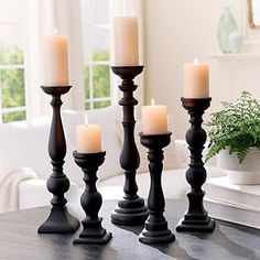 a group of candles sitting on top of a table