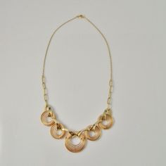 A fine hand made 1940s high art deco necklace in rose and yellow gold. This divine necklace features a central hand made focus that is hand crafted in rose and yellow gold. The design is exceptionally streamlined. The necklace measures 17" long and is 13/16" wide (432mm x 20mm). Made from fine 14K rose and yellow gold it weighs a total of 23.19 grams. It is in excellent condition.This is a one of a kind original art deco necklace not a reproduction item in the deco style. An appraisal shall acco Gatsby Jewelry, 1920s Necklace, Rose Gold Chain Necklace, Retro Necklace, Art Deco Gold, Retro Necklaces, Modernist Ring, Rainbow Jewelry, Mid Century Jewelry