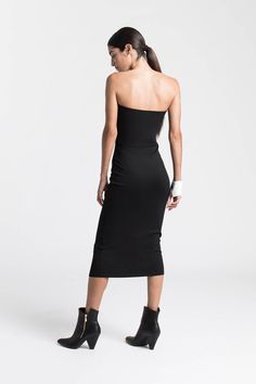 When sleek is spectacular. Our strapless midi Natalia Dress is the versatile LBD you’ve been waiting for. Our soft, structured and mid-stretch European ponte fabric gives her a slight sheen and a smoothing fit, while her sleek silhouette makes Natalia effortless to dress up or down. Wear her to date-night cocktails just as easily as you might to run around the corner - Natalia will go everywhere with you.[SPLIT] Sam is 5'8" (173 cm) tall, wearing size XS. Total length approximately 38" (95 cm). Fitted Bandeau Midi Dress For Spring, Chic Stretch Strapless Dress, Seamless Fitted Evening Dress, Strapless Elastane Midi Dress, Strapless Elastane Midi Dress For Party, Stretch Midi-length Bandage Dress For Evening, Stretch Midi Length Bandage Dress For Evening, Fitted Versatile Midi Dress For Spring, Strapless Party Midi Dress