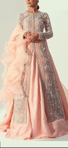 Product Description:  A beautiful Peach wedding oufit featuring luxurious handwork. The arms have beautiful embroidery work on it too. Color: Peach Can be customized in any color Peach Embroidered Sharara For Wedding, Wedding Lehenga In Peach With Zari Work, Embroidered Peach Sharara For Wedding, Peach Sharara For Wedding, Floor-length Lehenga With Intricate Embroidery For Wedding Reception, Peach Sharara With Resham Embroidery For Wedding, Peach Resham Embroidery Sharara For Wedding, Peach Floor-length Lehenga For Wedding, Festive Peach Gown For Wedding