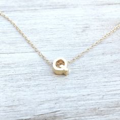 Gold Initial Necklace - make someone happy with this cute simple initial necklace. Sooo sweet! tiny little gold filled letter bead on 14k gold filled dainty chain.It is so cute! you will definitely love it :)A petite tiny 5 mm gold filled letter bead necklace.Simple, beautiful and chic jewelry.Necklace Measures Approximately 17"Please specify your letter If you would like this chain altered, please convo me. All my jewelry are packed in an elegant gift box.If you want to give it as a gift you can specify the address and I'll be happy to send it on your behalf. Simple Tiny Initial Pendant Charm Necklaces, Simple Gold-colored Sterling Silver Initial Necklace, Simple Tiny Initial Pendant Charm Necklace, Gold Charm Necklaces With Letter Beads, Simple Tiny Initial Pendant Necklace, Dainty Initial Necklace In Yellow Gold For Birthday, Simple Initial Pendant Charm Necklaces, Simple Gold Sterling Silver Initial Necklace, Dainty Initial Necklace For Birthday