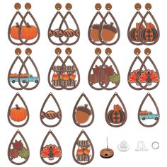 a bunch of pumpkins and other decorations hanging from hooks on a wall in front of a white background