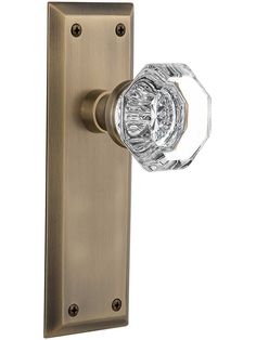 an antique brass door handle with crystal knob