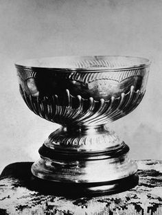 a silver bowl sitting on top of a table