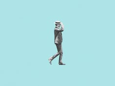 a man in a suit and hat walking across a blue sky