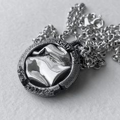 "At the moment we have difficulties with the payment system and we only accept payment through PAYPAL. When placing an order, select PAYPAL as a payment method. Otherwise, we will have to cancel your order. Thank you for understanding! the GATE pendant with chain Silver 925 outer diameter: 22-23 mm Inner diameter: 16-17 mm thickness: 2-3 mm. (Chain type and length may vary) My Instagram followers helped me choose a name for this, but I think they read the message correctly that I wanted to show Silver Hand Cast Round Pendant Necklace, Silver Electroformed Round Pendant Necklace, Sterling Silver Pendant Necklace Electroformed, Brutalist Pendant Jewelry Gift, Brutalist Sterling Silver Pendant Necklace, Brutalist Pendant Necklace For Gift, Silver Brutalist Necklace As Gift, Silver Brutalist Necklace For Gift, Brutalist Silver Necklace For Gift