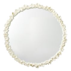 a round mirror with white flowers on the rim and bottom half is shown against a white background