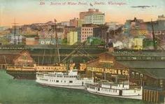 an old postcard shows two boats docked in the water next to a large city