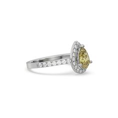 This Fancy Yellow Pear Diamond Halo Engagement Ring is made with a fancy yellow pear solitaire diamond set in a three-prong setting, surrounded by a halo of round diamonds all set on a pave band with round cut diamonds.Details: - Made to Order- Focal Diamond Weight: 1.00 CT, 1.50 CT, 2.00 CT, 2.50 CT, 3.00 CT- Accent Diamond Weight: 0.47 CT - 0.60 CT (Carat weight varies based on chosen Focal Diamond) - Diamond Type: Lab Grown Diamond (CVD, HPHT)- Focal Diamond Cut: Pear- Accent Diamond Cut: Rou Yellow Diamond Ring With Halo, Elegant Yellow Pear-shaped Diamond Ring, Fine Jewelry Yellow Diamond Ring With Halo Design, Yellow Diamond Pear-shaped Ring, Pear-shaped Yellow Diamond Ring For Wedding, Yellow Pear-shaped Diamond Rings, Yellow Pear Shaped Fine Jewelry Rings, Yellow Pear-shaped Wedding Rings, Pear-shaped Diamond Halo Ring