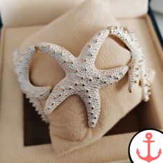 Introducing the White Starfish Ring: The Perfect Nautical Jewelry for Sea Lovers Calling all sea enthusiasts! Dive into the world of nautical jewelry with our stunning White Starfish Ring. This trendy and fashionable ring is crafted from high-quality zinc alloy, making it not only stylish but also durable. Its white and gold plated color adds a touch of elegance to any outfit, making it perfect for any occasion. As passionate lovers of the sea, we understand the significance of nautical symbols. White Adjustable Starfish Bracelet, Ocean-inspired White Starfish Bracelet, Ocean-inspired White Jewelry With Starfish Charm, Cheap Ocean-inspired Starfish Bracelet, Nautical Symbols, Ocean-inspired Bracelet With Starfish Charm, Vintage Boho Outfit, Starfish Ring, Starfish Jewelry