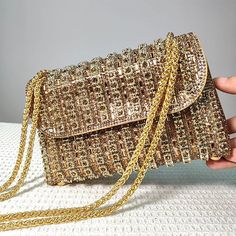 Add some sparkle to your outfit with our Glamorous Chain Strap Handbag. This stunning bag is designed for luxurious women who want to make a statement. With its diamond shoulder bag and gold chain strap, it's the perfect accessory for a party or a night out. Experience true luxury with our exclusive bag. Gold Shoulder Bag With Chain Detail, Rectangular Chain Shoulder Bag For Parties, Glamorous Clutch Bag With Chain Detail, Glamorous Clutch Bag With Chain, Trendy Party Bags With Chain Detail, Gold Shoulder Bag Clutch With Chain, Gold Shoulder Clutch With Chain, Party Evening Shoulder Bag With Chain, Trendy Party Bag With Chain Strap