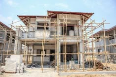 a house under construction with scaffolding around it