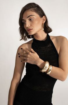 Embolden your stack with this polished bangle that's extracurvy and spangled with crystals of all shapes. 1 1/2" width 14k-gold plate/zircon Imported Chic Gold-tone Cuff Bangle Bracelet, Chic Gold Stackable Cuff Bracelet, Chic Gold Stackable Bangle, Chic Gold-tone Bracelets For Party, Gold Plated Cuff Bracelet For Party, Gold Plated Bangle Cuff Bracelet For Party, Modern Gold Bangle Bracelet For Party, Luxury Gold Bangle For Party, Glamorous Gold Bangle Jewelry