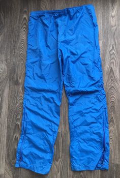 Fantastic 70's Nike full runner/track suit. Jacket is 1/4 zip with zip kangaroo pocket and huge swoosh on back. Pants have drawstring waist and zip ankles. Light wear (pants have some unraveling at waist---see pics, still completely functional but allows the waist seam to flip up) but overall excellent condition. Never ending style! Check out other sensational vintage Nike gear in my shop https://www.etsy.com/shop/sweetVTGtshirt?section_id=11916484&ref=shopsection_leftnav_4 Label: Nike. USA Winter Sports Parachute Pants With Pockets, Sporty Parachute Pants For Winter Outdoor Activities, Sporty Nylon Pants For Winter Sports, Sporty Parachute Pants For Outdoor Winter Activities, Sporty Winter Parachute Pants For Outdoor Activities, Blue Nylon Parachute Pants For Sports, Blue Outdoor Activewear With Pockets, Blue Activewear With Pockets For Outdoor, Outdoor Blue Activewear With Pockets