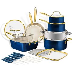 an assortment of pots and pans are shown with gold handles, blue lids, and matching utensils