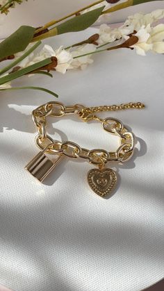 Lock and Heart charm bringing on mind the promises of Eternal Love between each others 𝐌𝐀𝐓𝐄𝐑𝐈𝐀𝐋: 18k Gold plated bracelet 𝐂𝐀𝐑𝐄 𝐓𝐈𝐏𝐒: Avoid contact with moisture (water, perfume and other chemicals) Mostly take off jewelry when exercising, showering, sleeping When not in use store your pieces in the jewelry bag or box. Water Perfume, Gold Plated Bracelet, Jewelry Bag, Gold Plated Bracelets, Wide Belt, Eternal Love, Jewelry Bags, Care Tips, Heart Charm