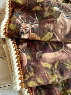 two deers are shown on the fabric