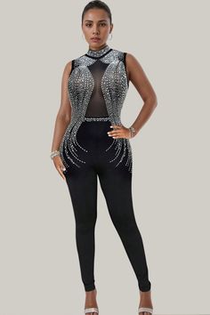 Experience exquisite luxury with the Mara Studded Mesh Sleeveless Jumpsuit. Featuring contrasting mesh and dazzling rhinestone details, the sheer sleeves add a touch of sophistication. This long, sleeveless jumpsuit boasts a regular fit and high waistline, made from a slight stretch polyester material. Be enchantingly elegant in this semi-sheer masterpiece. 88% Polyester, 12% Elastane Model is wearing size small Please allow 3-5 business days to process and ship. in cm : Size US Length Inseam Bu Glamorous Sleeveless Jumpsuits And Rompers For Night Out, Glamorous Sleeveless Jumpsuit For Night Out, Elegant Sleeveless Bodysuit For Evening, Elegant Sleeveless Bodysuit For Party, Elegant Sleeveless Evening Bodysuit, Glamorous Sleeveless Evening Bodysuit, Glamorous Evening Jumpsuits And Rompers With Rhinestones, Sleeveless Embellished Jumpsuits And Rompers For Night Out, Embellished Sleeveless Jumpsuits And Rompers For Night Out