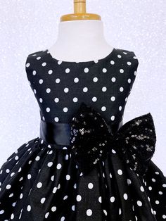 Hand stitched together with the upmost care, this dress is perfect for any occasion: birthdays, pageants, photoshoots, and holiday parties! The comfortably soft polka dot dress is made out of cotton material; The bodice is sleeveless with a zipper in the back. The dress comes with a detachable ribbon sash and mini sequin small bow to add sparkle. Knee length skirt made out of cotton polka dot fabric. Under the skirt is one layer of lining with crinoline attached to add extra puffiness. *Mannequi Spring Sleeveless Pageant Dress, Sleeveless Spring Pageant Dress, Holiday Princess Sleeveless Dress For Parties, Holiday Sleeveless Princess Dress For Party, Sleeveless Holiday Princess Dress For Party, Holiday Party Sleeveless Princess Dress, Fitted Princess Dress With Bow For Dress-up, Sleeveless Princess Dress For Wedding And Party Season, Sleeveless Princess Dress For Wedding