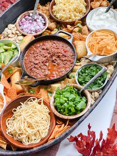 a large platter filled with lots of different types of food and condiments