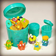 there are many plastic toys in the trash can