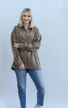 The Boone Day Plaid Brown Shacket is the ultimate cozy piece for your Fall and Winter wardrobe. The warm brown tones make this the perfect Fall festivity accessory! This shacket is detailed with long sleeves with buttons on the cuff, welt pockets, functional buttons, collar and a clean hem. Pair this shacket with your favorite mom jeans, boots and a basic white tee for a timeless and cozy look! - Runs true to size - Button down shacket - Long sleeves - Button on sleeve cuffs - Collar - Clean hem Brown Collared Outerwear With Button Cuffs, Brown Collared Outerwear With Button Closure, Classic Tops With Buttoned Pockets For Fall, Brown Collared Outerwear With Buttons, Brown Button-up Top With Pockets, Fall Outerwear With Buttoned Pockets And Fold Down Collar, Brown Long-sleeved Outerwear With Button Closure, Beige Long Sleeve Shacket With Buttoned Pockets, Brown Fall Outerwear With Button Cuffs