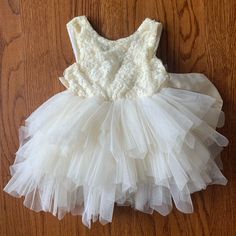 Reposhed! Ordered For My Daughter For A Wedding But She Wasn’t Able To Attend. Never Worn By Us! Cream Princess Style Sleeveless Baptism Dress, Spring White Tutu Dress With Lace Bodice, Cream Sleeveless Princess Dress For Baptism, Cream Sleeveless Princess Tutu Dress, Sleeveless Ruffled Tutu Dress For First Communion, Cream Tutu Dress With Ruffles For Baptism, Cream Ruffled Tutu Dress For Baptism, Cute Cream Princess Dress For Baptism, Cream Ruffled Baptism Dress For Dress-up