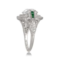 A beautiful Estate Emerald Cut Diamond Engagement Ring, accented by a tapered baguette and bullet-cut diamonds on either side. Luxury Emerald Three Stone Ring For Formal Occasions, Luxury Three Stone Emerald Ring For Formal Events, Luxury Three Stone Emerald Ring For Formal Occasions, Platinum Emerald Ring With Vvs Clarity In Diamond White, Platinum Emerald Ring With Diamond Accents In Diamond White, Diamond White Emerald Ring With Diamond Accents In Platinum, Platinum Emerald Ring With Vvs Clarity, Classic Platinum Emerald Ring, Exquisite Platinum Emerald Ring With Prong Setting