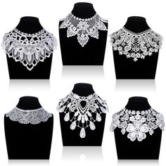 six different styles of necklaces on mannequins with white lace and beads