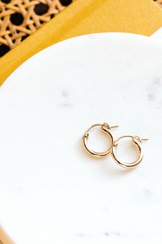 These tiny hoops will be your new favorite! Our Everyday Hoop Earrings are simple, lightweight and go with just about any outfit! Pick from gold fill or sterling silver - materials durable enough for everyday wear. Find dainty necklaces, dainty stacking rings, and everyday bracelets, and more at Simple & Dainty! Everyday Bracelets, Perfect Lifestyle, Necklaces Dainty, Dainty Necklaces, Everyday Bracelet, Mini Earrings, Elevate Your Outfit, Trendy Earrings, Dangling Earrings