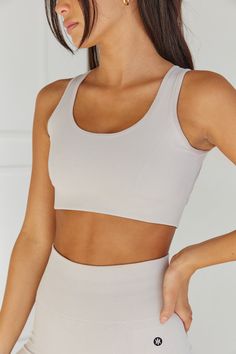 Composed of our signature buttery-soft Nylon and Spandex seamless blend, our Velocity Sports Crop was designed to be your new staple. Notable features include an open-back design for maximum breathability, removable padding, and a non-slip under-band for maximum support. • Model is 5'7"/170cm, 34"/85cm Bust, 24"/61cm Waist, 35"/89cm Hip and wears a size Small• On average, customers say it fits true to size• Material Make-up: 60% Nylon, 30% Polyester, 10% Spandex Beige Stretch Sports Bra With Built-in Bra, Solid Color Compression Sports Bra In Seamless Fabric, Fitted Seamless Nylon Sports Bra, Fitted Nylon Sports Bra With Seamless Design, Beige Stretch Athleisure Sports Bra, Beige Sports Bra With Built-in Bra, Seamless Micro-elastic Sports Bra For Pilates, Seamless Nylon Sports Bra For Pilates, Beige Athleisure Activewear For Yoga