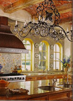 a painting of a kitchen with an island and chandelier hanging from the ceiling