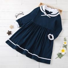 Girls Long Sleeve Casual Princess Pleated Dress Girls Wholesale Clothing - PrettyKid Long Sleeve Cotton School Dress, Cute Winter Dress For School, White Long Sleeve School Dress, Blue Long Sleeve Preppy Dress, Long Sleeve Winter School Dress, Cute Navy School Dress, Navy School Dress For Spring, Preppy Cotton Dress For Fall, Mum And Baby