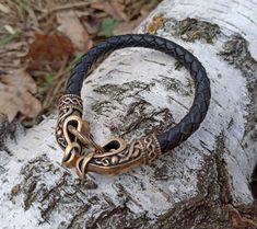 The custom wristband is made from 8 mm | 3/10 inch natural braided leather cord. The Norse dragon clasps are made from Italian bronze solid by hand casting. The cuff bracelet shipped in wooden jewelry box, so it can be perfect mens gift option. The bracelet can be used for men or women. If you like Viking warrior or Celtic jewelry - you`ll like this bangle. Norse Dragon, Norse Warrior, Custom Wristbands, Hand Casting, Viking Dragon, Norse Jewelry, Natural Braids, Viking Culture, Dragon Bracelet