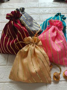 Product Item:Both Side Full Gota Potli Bags With Tassels Material: Brocade Fabric ,Gota Patti. Size:-7 x 5 Inches Approx Color- Assorted Color will be send ( Color can be customize) Details - Potli Bag: Exquisite potli bag adorned with golden touch, adding a touch of elegance and charm to any outfit. Wedding Favors: Perfect for weddings, Haldi , Mehndi these potli bags can be delightful favors for guests, offering a blend of tradition and style. The extravagant style of Gujarat comes to life thr Rectangular Shoulder Bag For Diwali Party, Festive Pink Rectangular Potli Bag, Red Shoulder Bag For Festivals As Gift, Red Shoulder Bag For Festivals And Gifts, Red Shoulder Bag As Festival Gift, Red Shoulder Bag For Festivals, Pink Bag For Festive Party, Festive Pink Bag For Party, Pink Party Bag For Festive Occasions