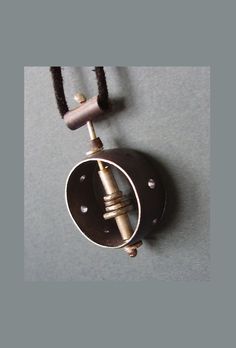 "This unique pendant is one of a kind with a unisex design. Modern, and contemporary style, handmade from sterling silver wire, forged silver, and pierced silver formed into a ring, oxidized black. Pendant measures approximately 1\" diameter, includes 18\" silver chain or leather cord. All jewelry is boxed and ready for gift giving. DETAILS: ~ Components are sterling silver  ~ Pendant measure approximately 1\" diameter ~ Ships at no extra charge. ~ Gift wrapping option available at checkout. Include your own special message in the card. ~ Handmade in Austin, Texas ❤️YOU MAY ALSO LIKE THESE ITEMS❤️ https://www.etsy.com/listing/72429573/radius?ref=shop_home_active_58&frs=1 https://www.etsy.com/listing/35670591/silver-domes-with-copper?ref=shop_home_active_53&frs=1 https://www.etsy.com/listin Minimalist Hand Cast Jewelry With Round Pendant, Hand Cast Adjustable Modern Jewelry, Hand Cast Modernist Jewelry For Gifts, Modern Oxidized Jewelry With Round Pendant, Modern Oxidized Round Pendant Jewelry, Modern Oxidized Pendant Jewelry, Modern Hand Cast Jewelry As Gift, Modernist Hand Cast Jewelry As Gift, Modernist Hand-cast Jewelry For Gifts