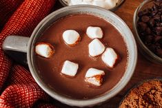 hot chocolate with marshmallows and cocoa on the side